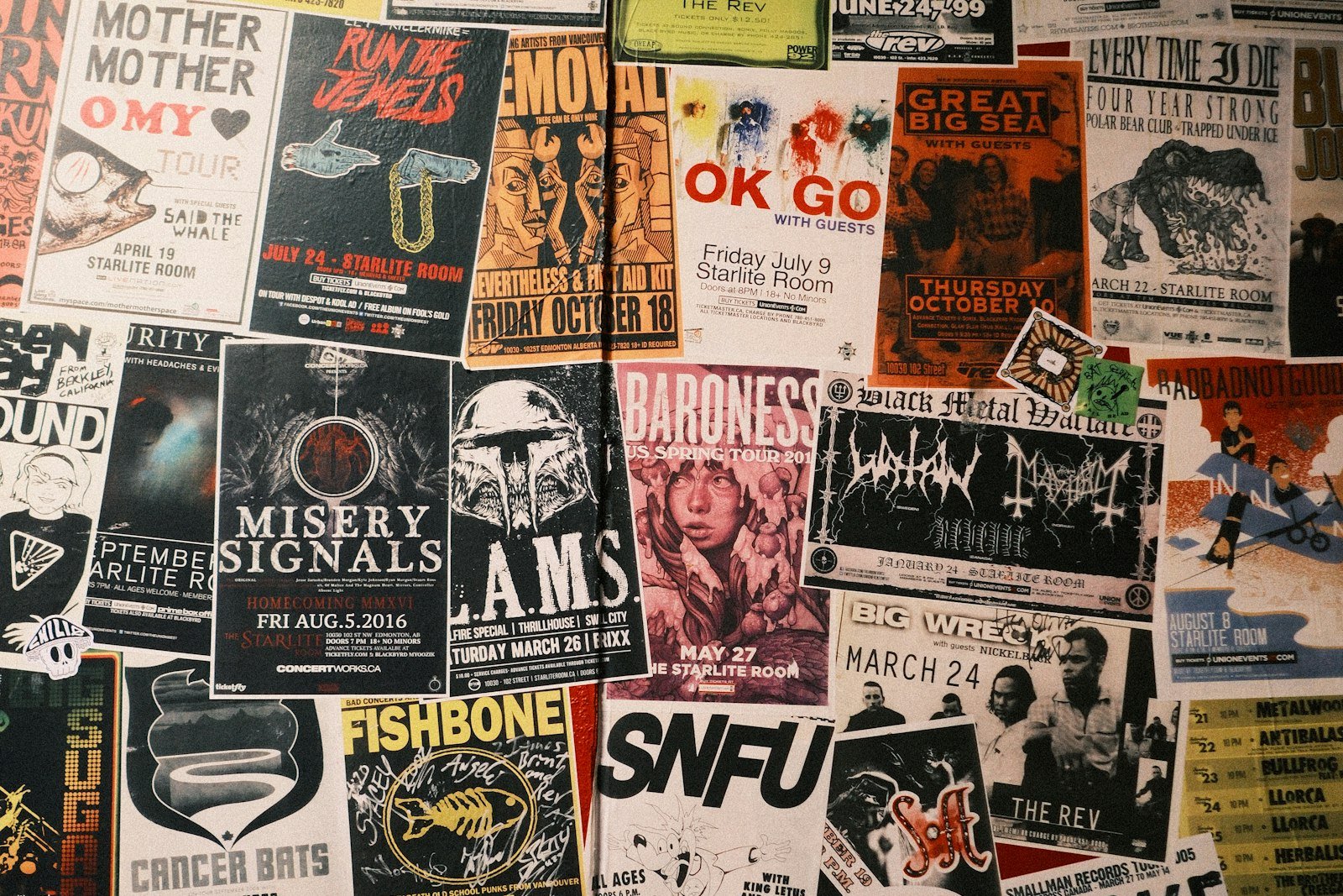 Wall papered edge to edge with overlapping band and tour posters for shows at the Starlite Room