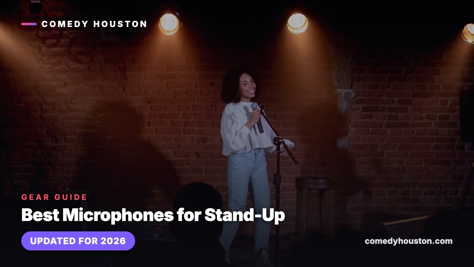 Gear guide cover card for the best microphones for stand-up comedy, over a photo of a comedian at a microphone stand on a brick-walled stage